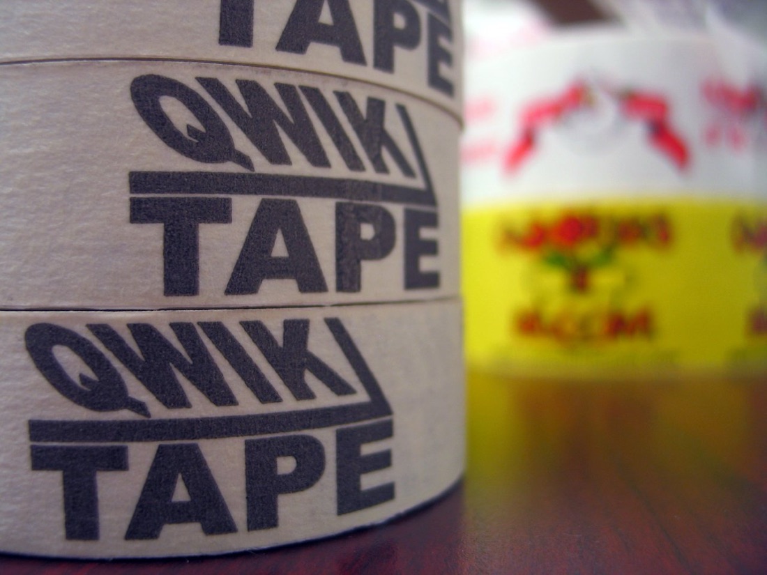 Stack of custom printed masking tape rolls