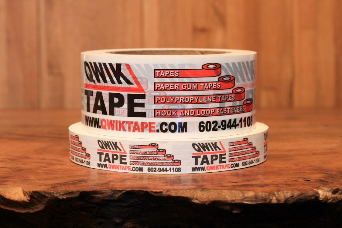 Custom printed Qwik Tape packing tape sealing a shipping box