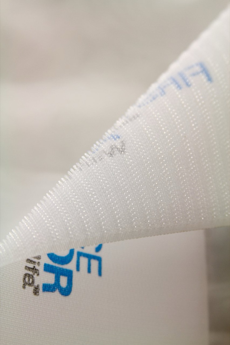 An assortment of custom printed tape rolls in many colors